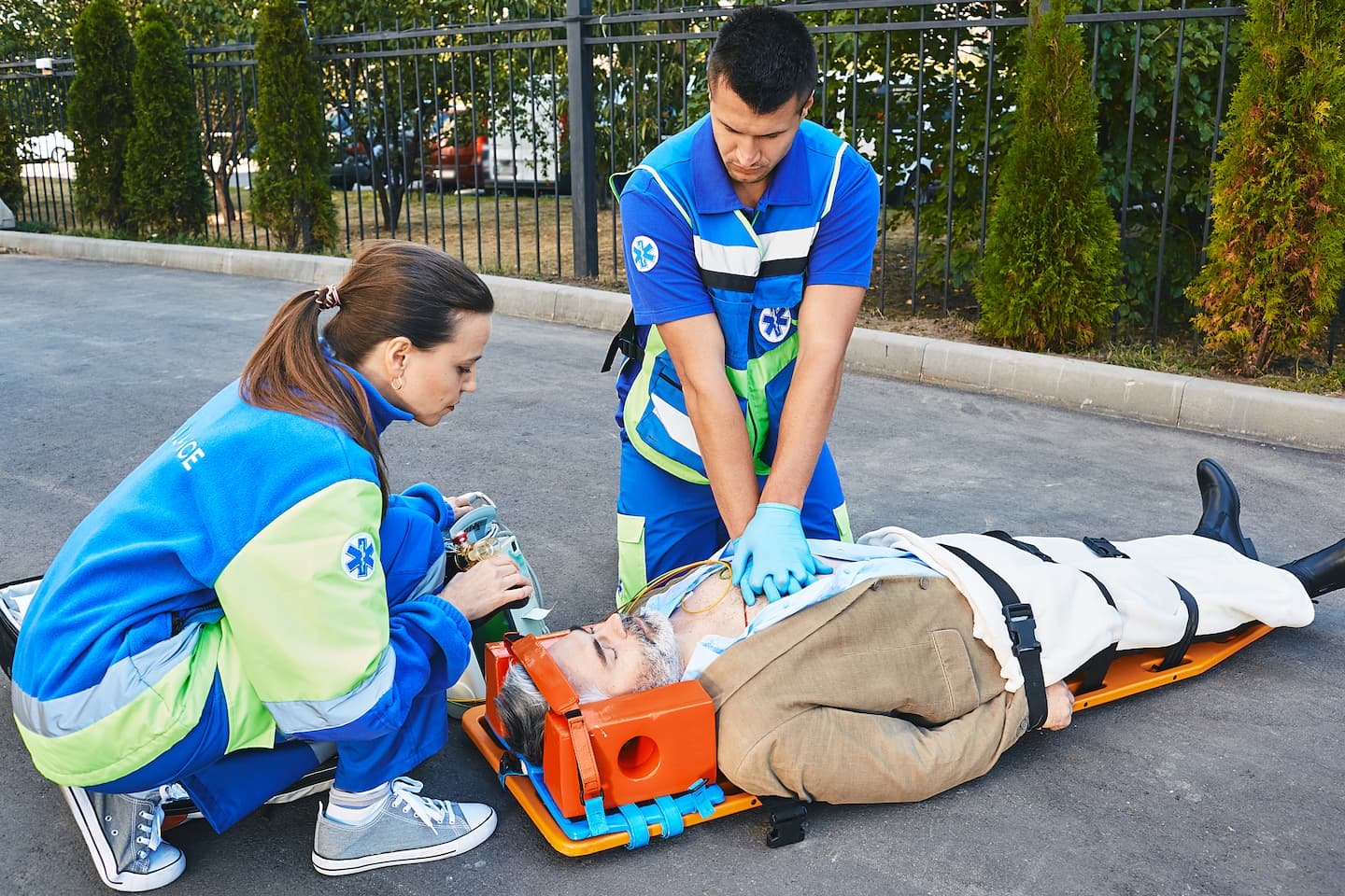 Emergency medics performing CPR on patient with spinal support stretcher in Chicago